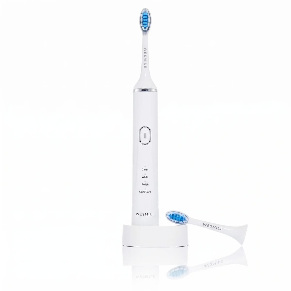 The Sonic LED Toothbrush on its charging stand with a spare head